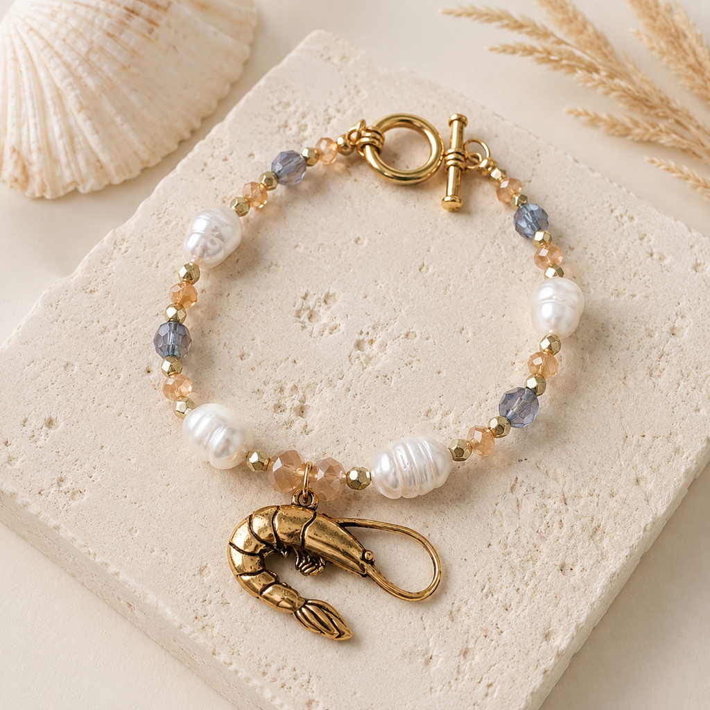 Bayou Shrimp Pearl Bracelet with freshwater pearls, faceted glass beads, antique-gold shrimp charm, and toggle clasp 