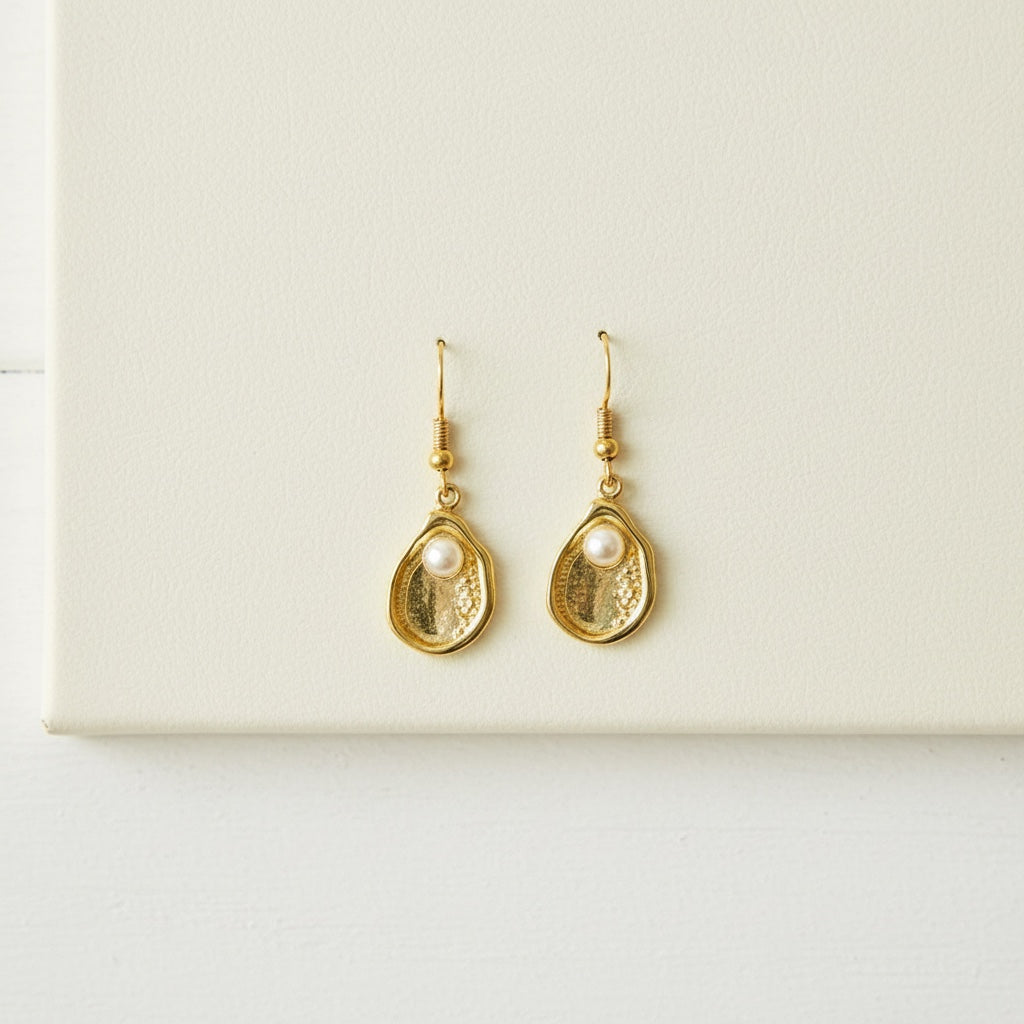 Southern coastal style oyster pearl earrings made with 18k gold-filled metal.